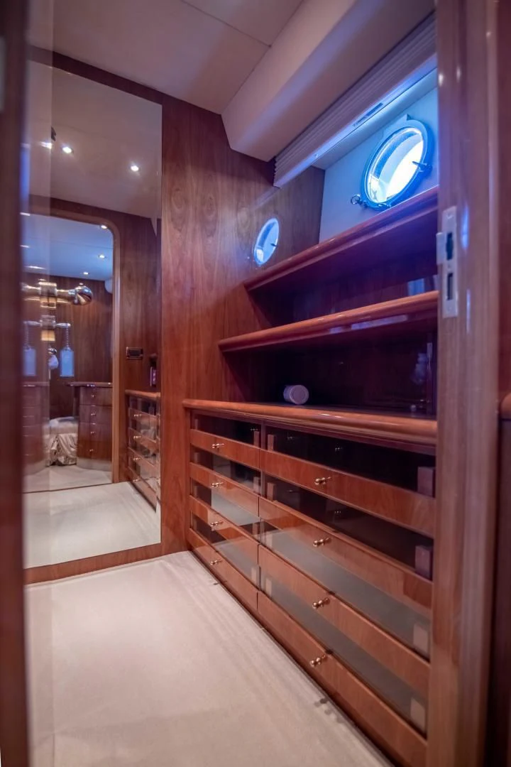 a room with wooden cabinets aboard ENCHANTED LADY Yacht for Sale