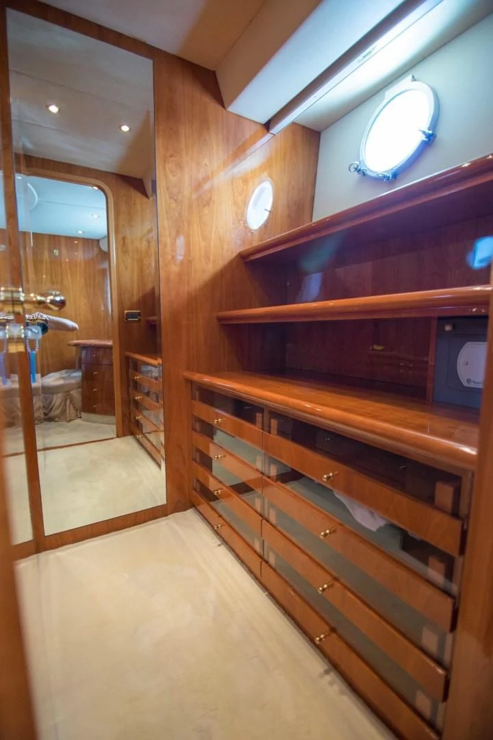 a bathroom with a wood cabinet aboard ENCHANTED LADY Yacht for Sale