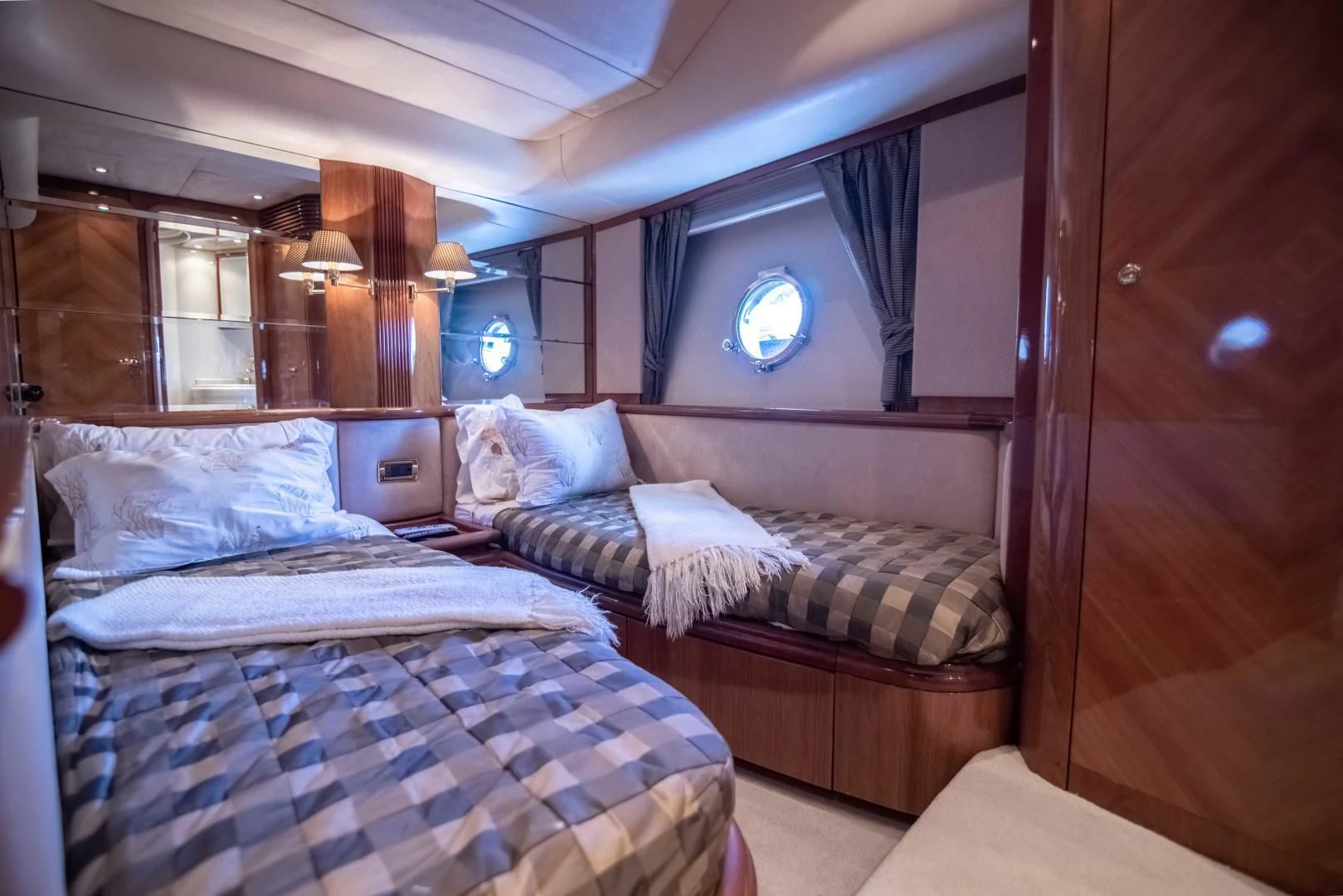 a room with a couple of beds aboard ENCHANTED LADY Yacht for Sale