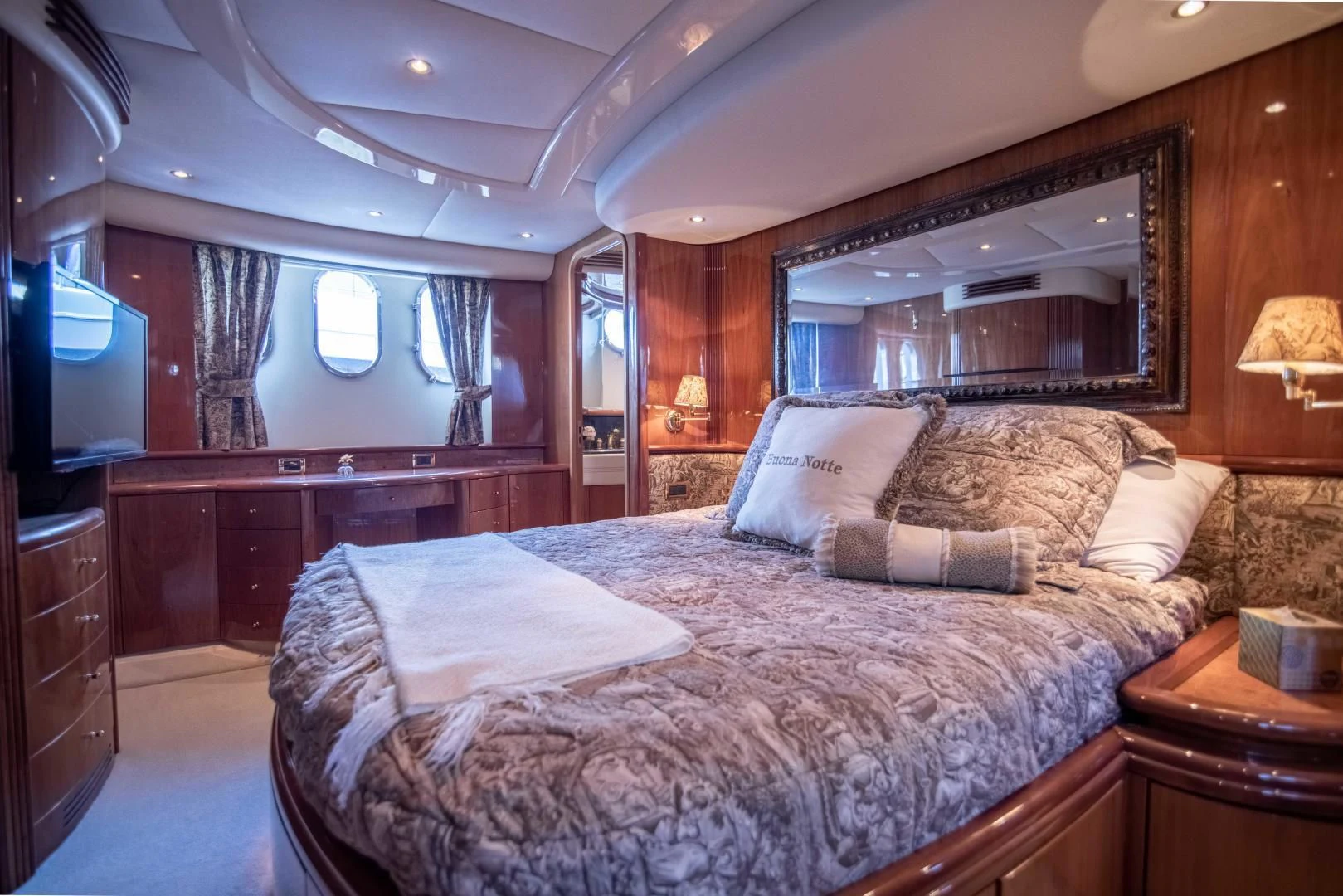 a large bed in a hotel room aboard ENCHANTED LADY Yacht for Sale