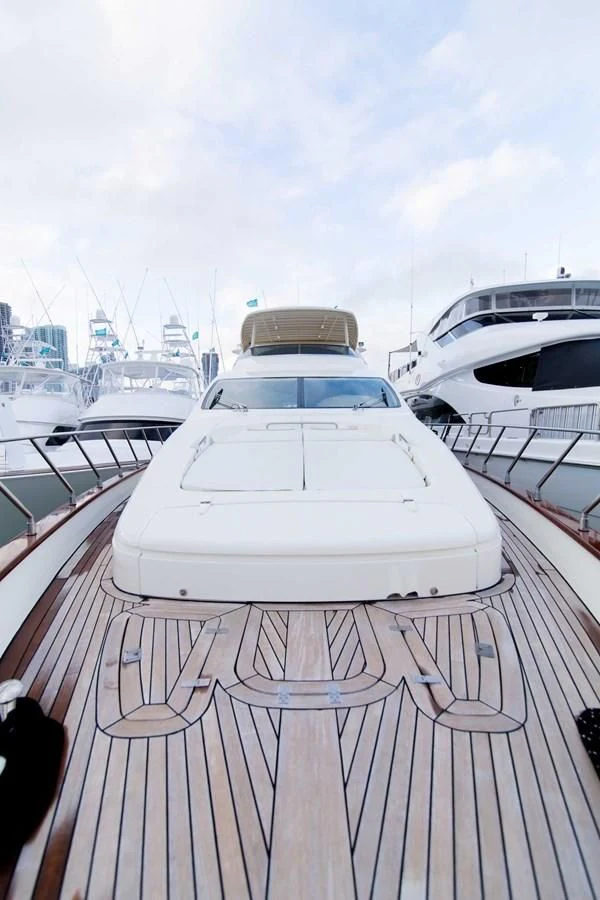 a white boat on a deck aboard ENCHANTED LADY Yacht for Sale