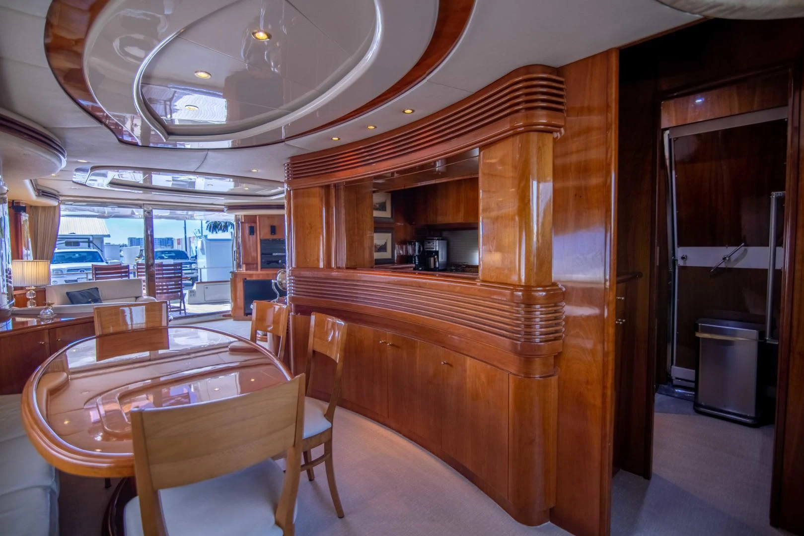 a wood table in a restaurant aboard ENCHANTED LADY Yacht for Sale