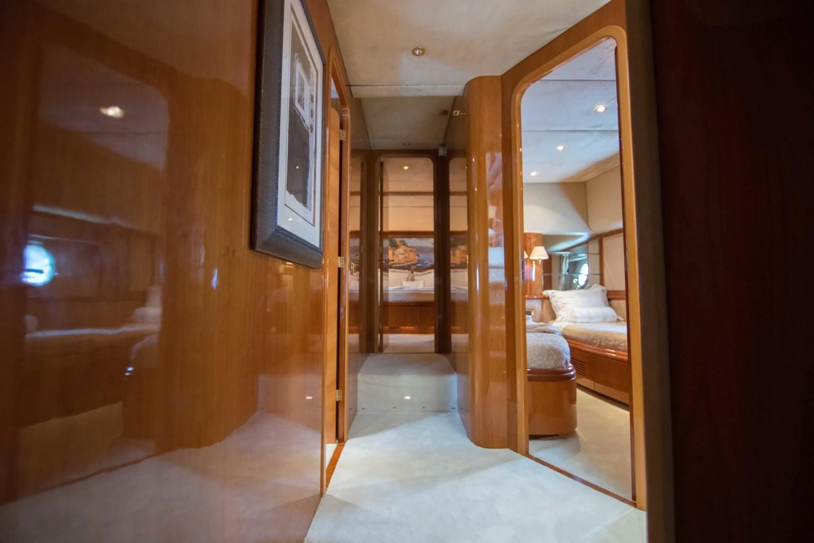 a room with a bed and a mirror aboard ENCHANTED LADY Yacht for Sale