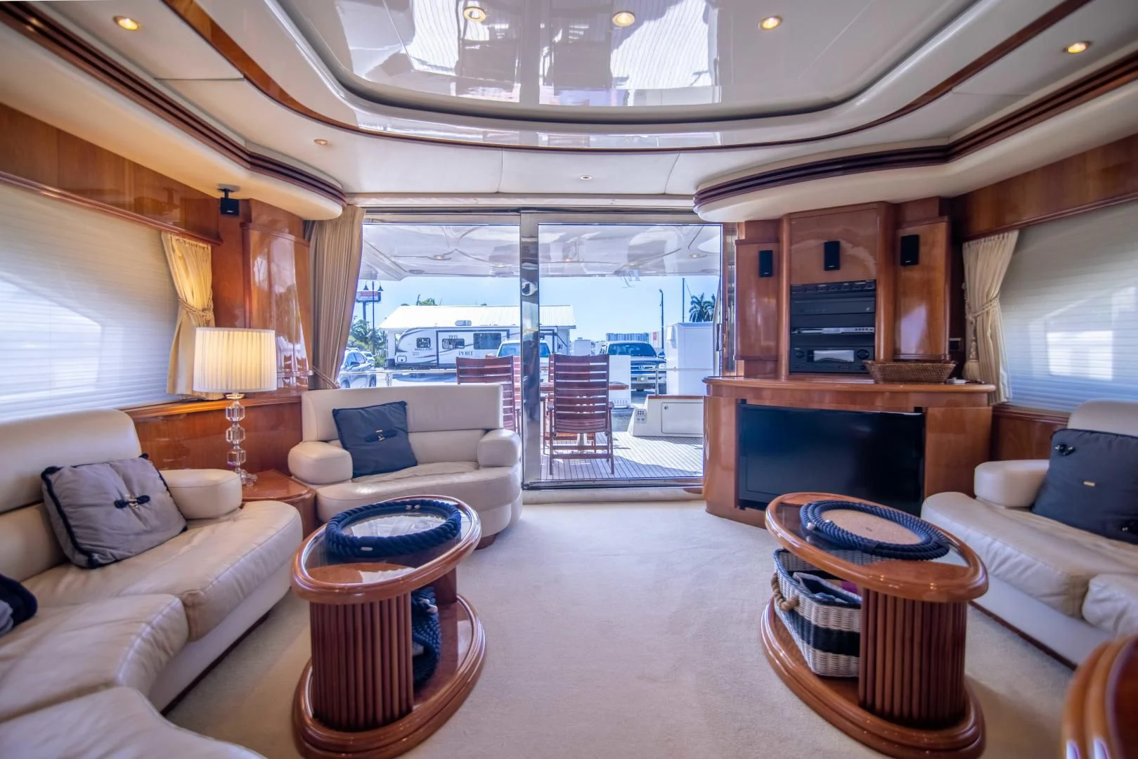a living room with a fireplace aboard ENCHANTED LADY Yacht for Sale
