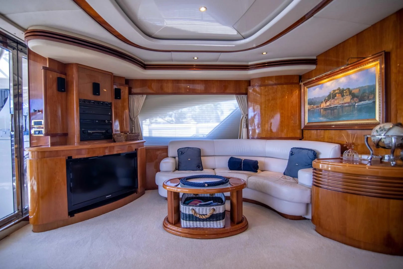a living room with a fireplace aboard ENCHANTED LADY Yacht for Sale