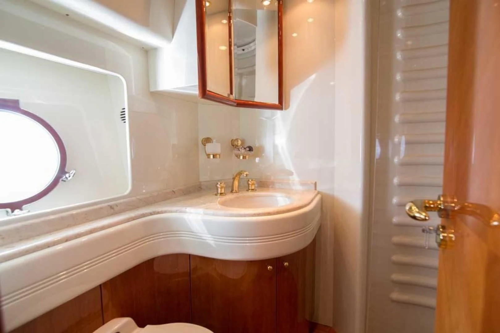 a bathroom with a sink and a mirror aboard ENCHANTED LADY Yacht for Sale