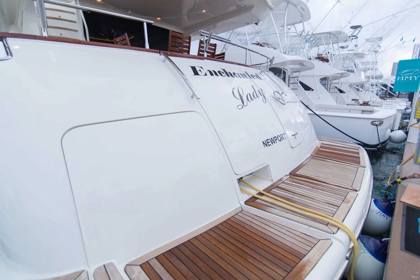 a white boat on a wooden deck aboard ENCHANTED LADY Yacht for Sale