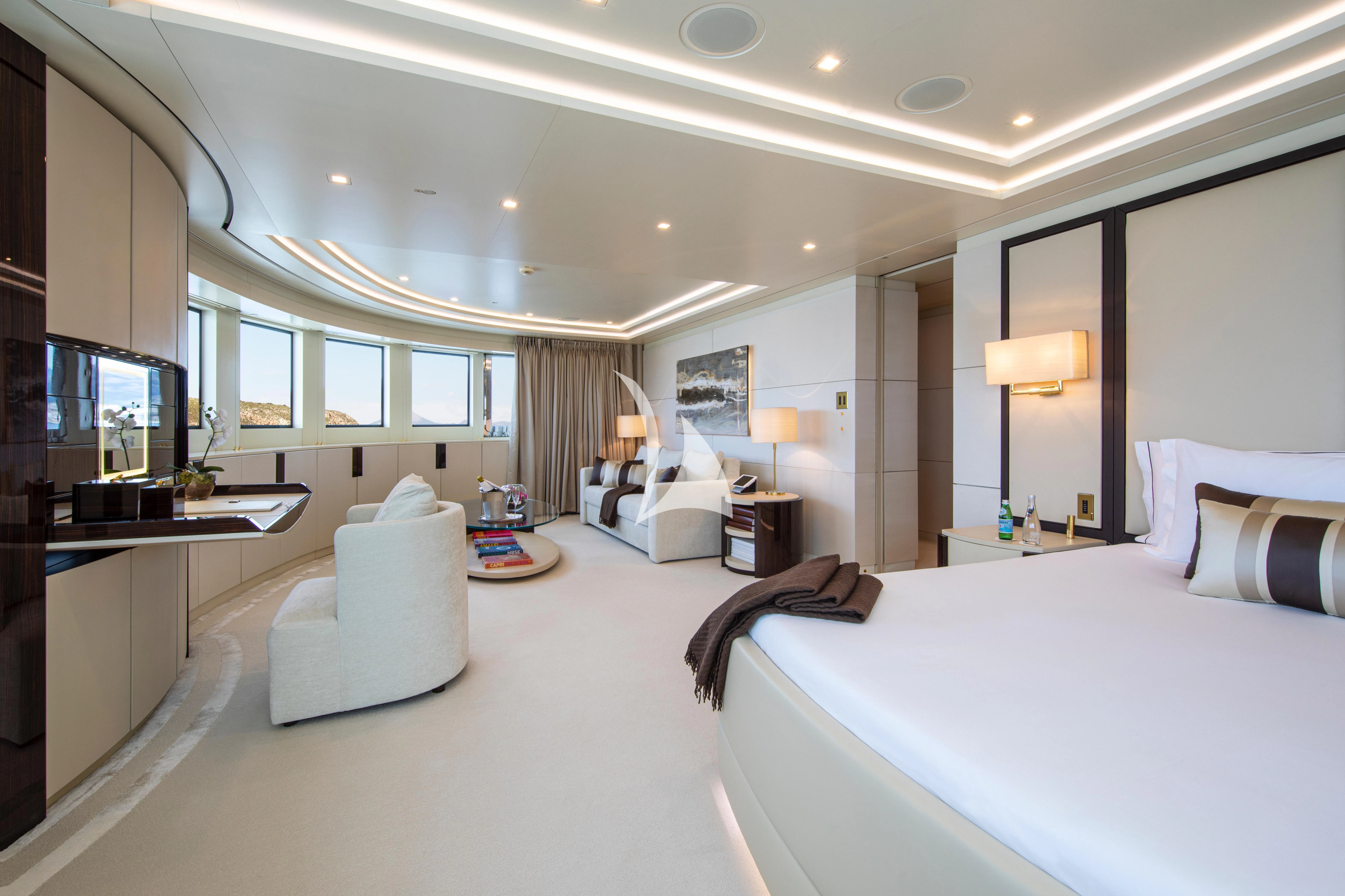 a hotel room with a bed and a desk aboard ROMA Yacht for Sale