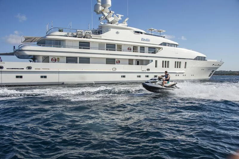 a large white boat with a person on it aboard ROMA Yacht for Sale