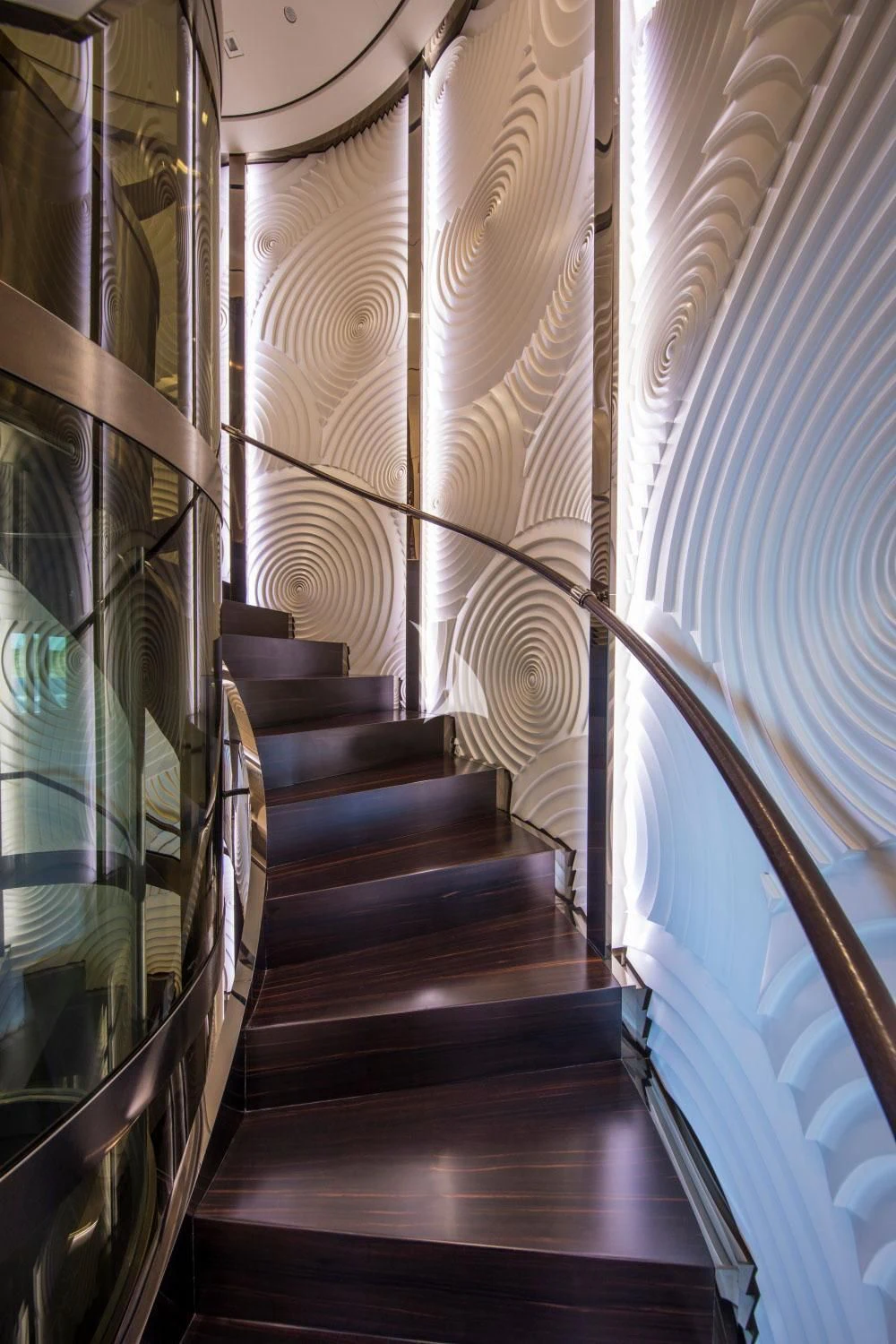 a staircase with a wood railing aboard ROMA Yacht for Sale