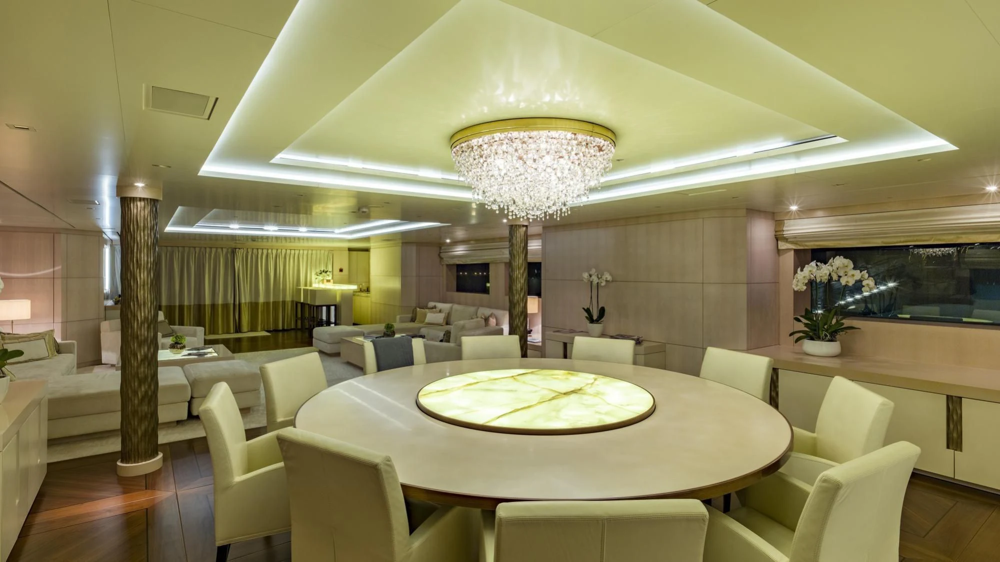 a room with a table and chairs aboard ROMA Yacht for Sale