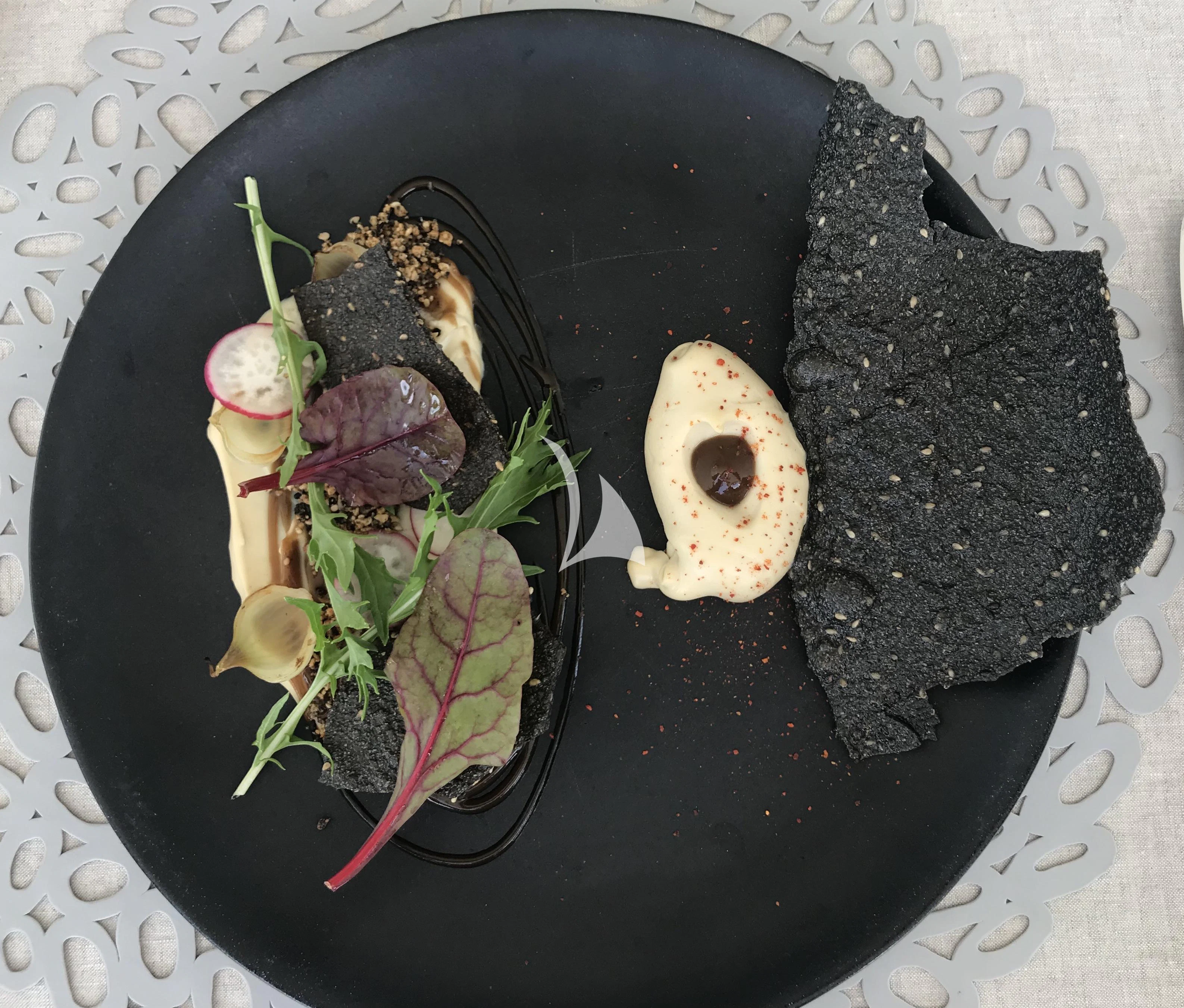 a plate of food aboard ROMA Yacht for Sale