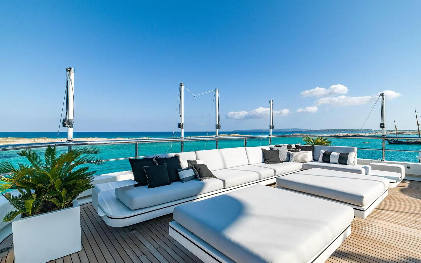 a rooftop with a pool and a view of the ocean aboard ROMA Yacht for Sale