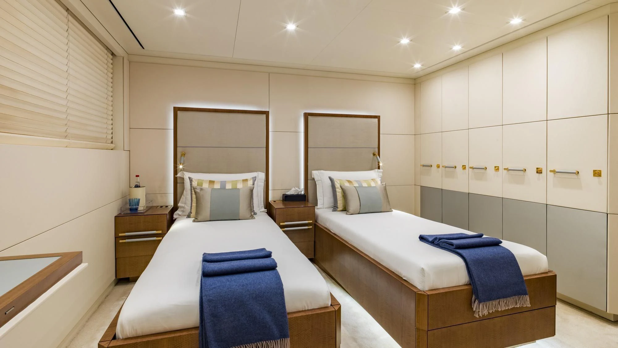 a couple of beds in a room aboard ROMA Yacht for Sale