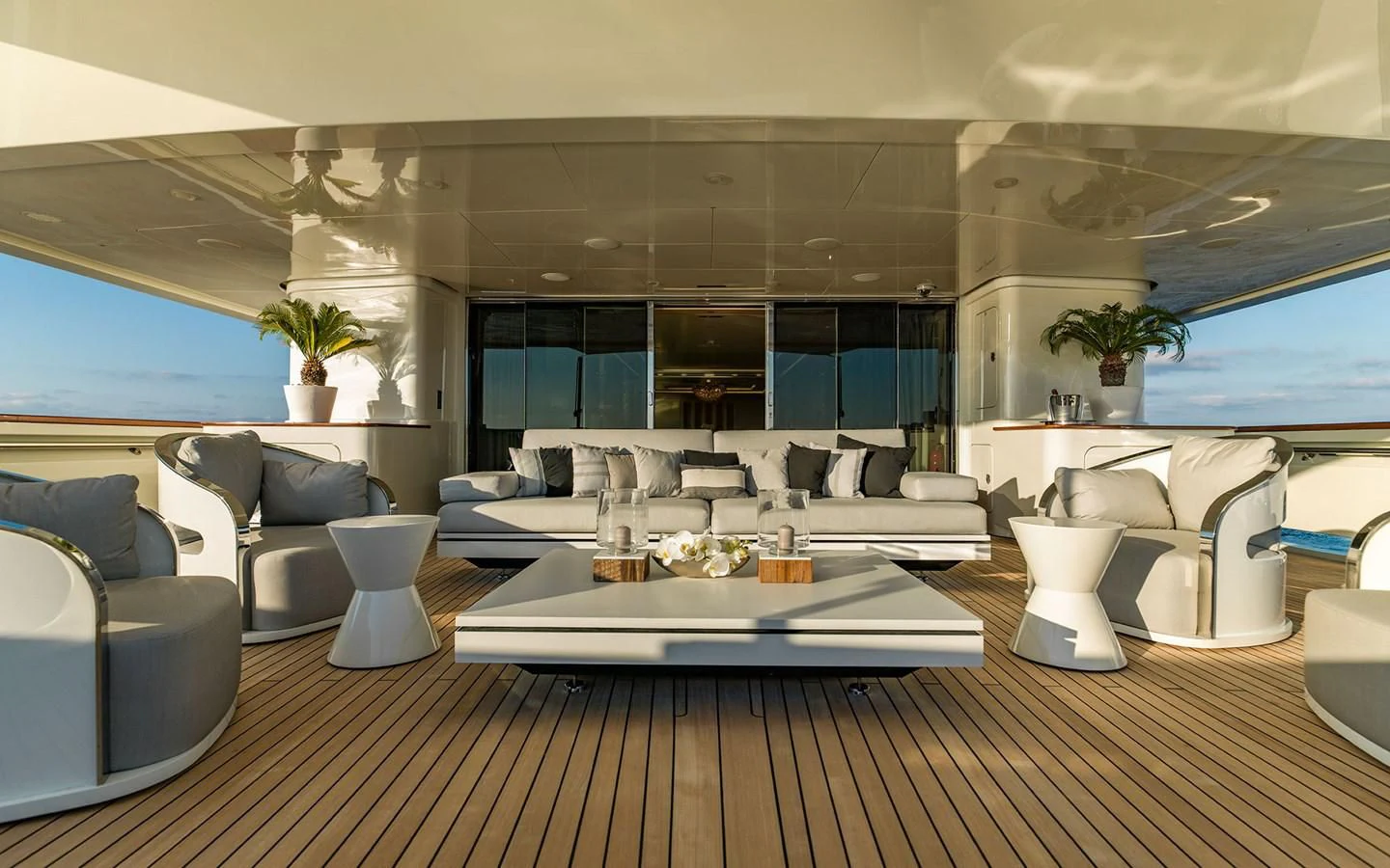 a large room with a table and chairs aboard ROMA Yacht for Sale