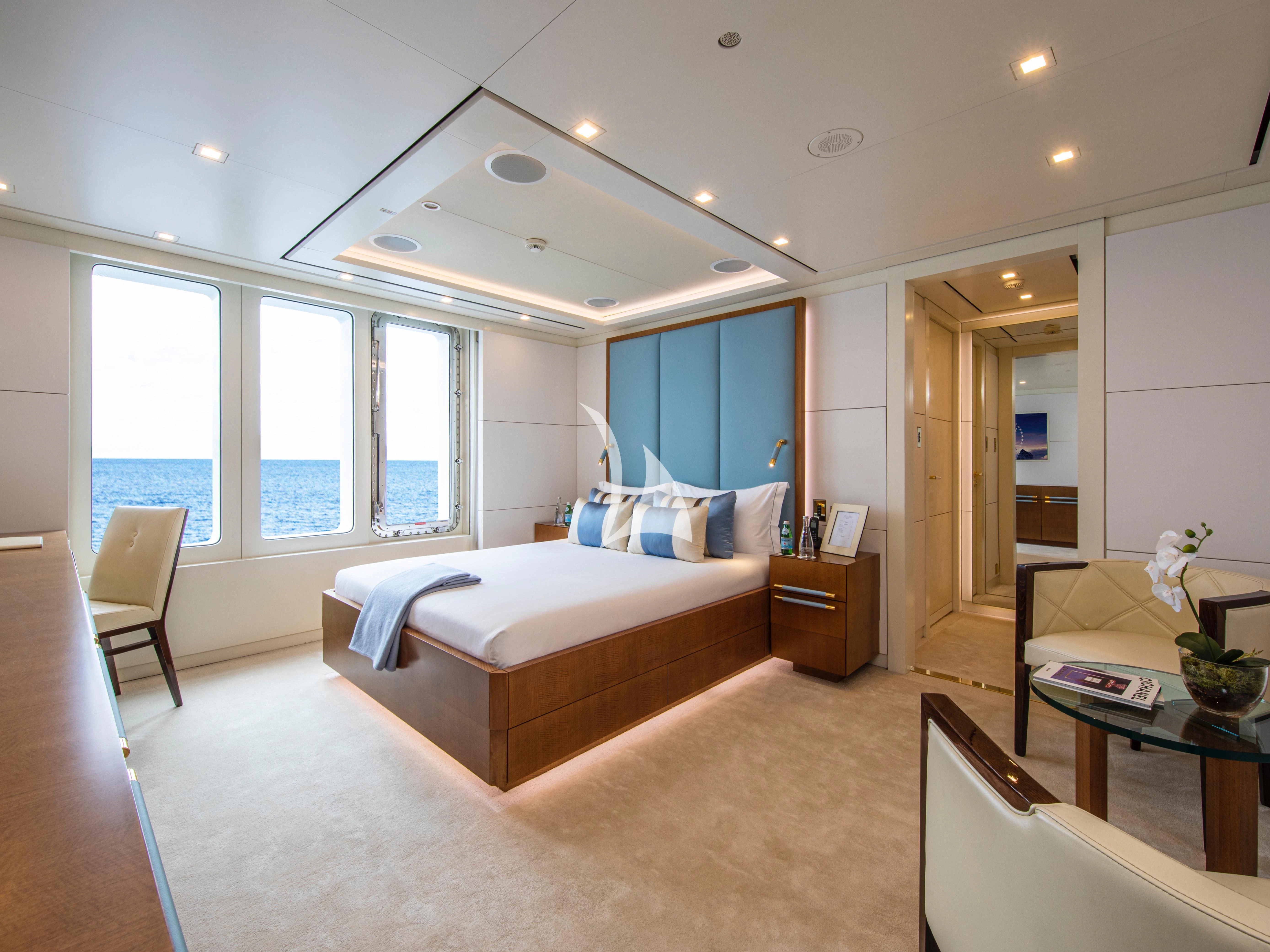 a bedroom with a large bed aboard ROMA Yacht for Sale