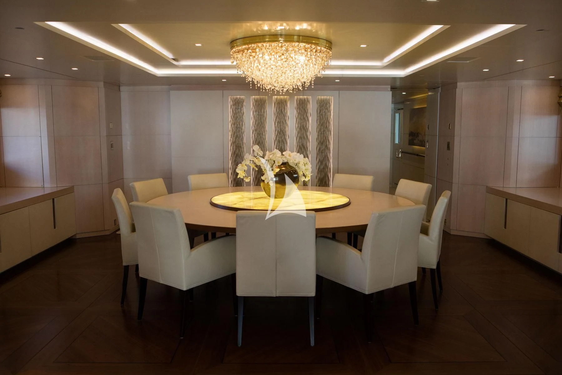 a room with a table and chairs aboard ROMA Yacht for Sale