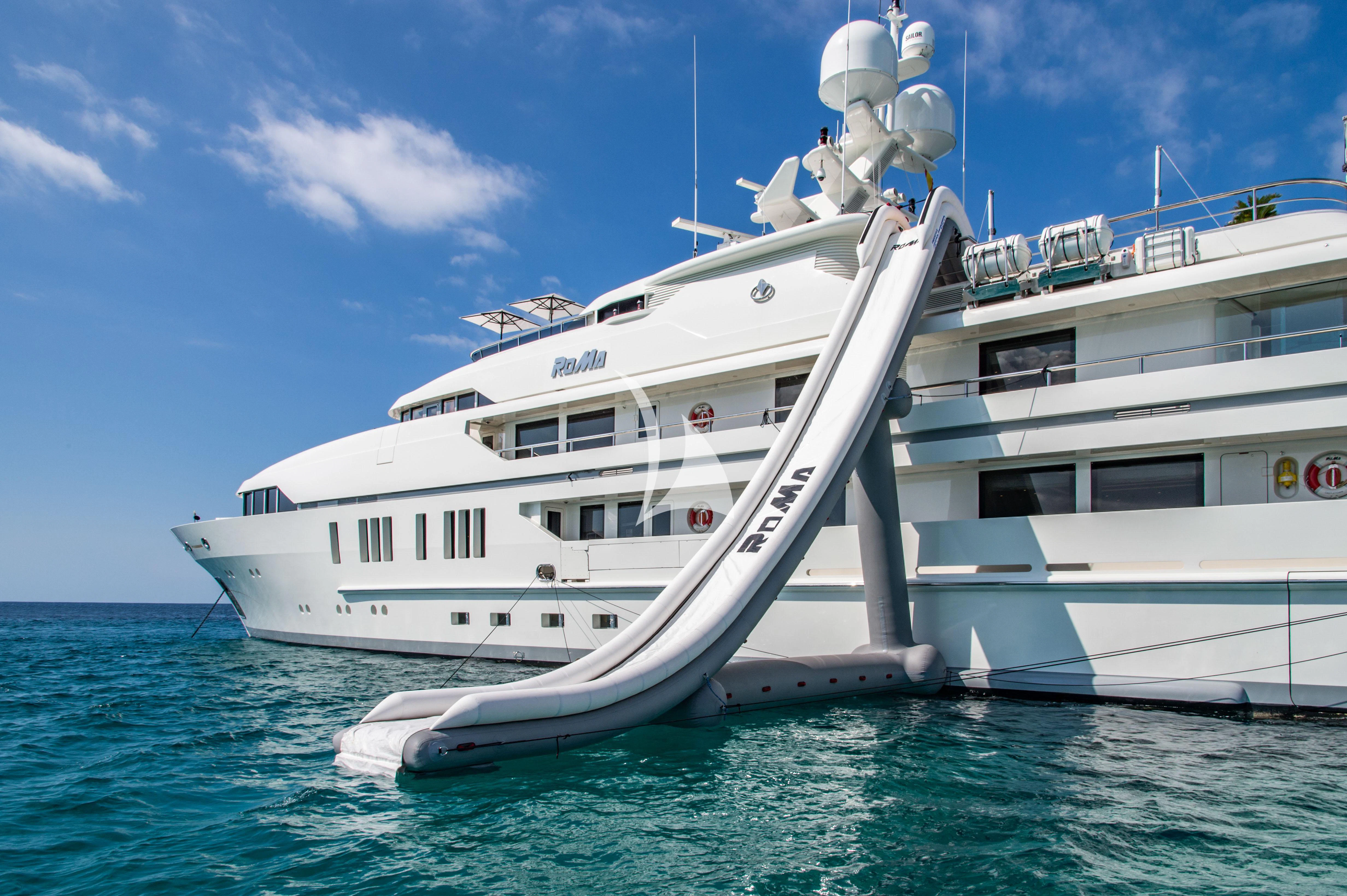 a large white boat in the water aboard ROMA Yacht for Sale