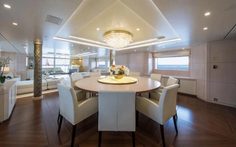 a large kitchen with white cabinets aboard ROMA Yacht for Sale