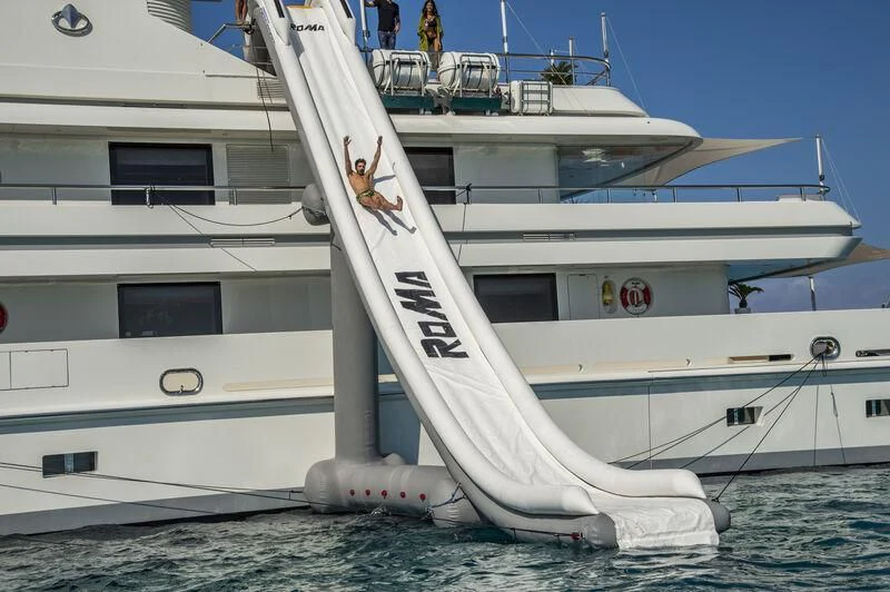 a white boat in the water aboard ROMA Yacht for Sale
