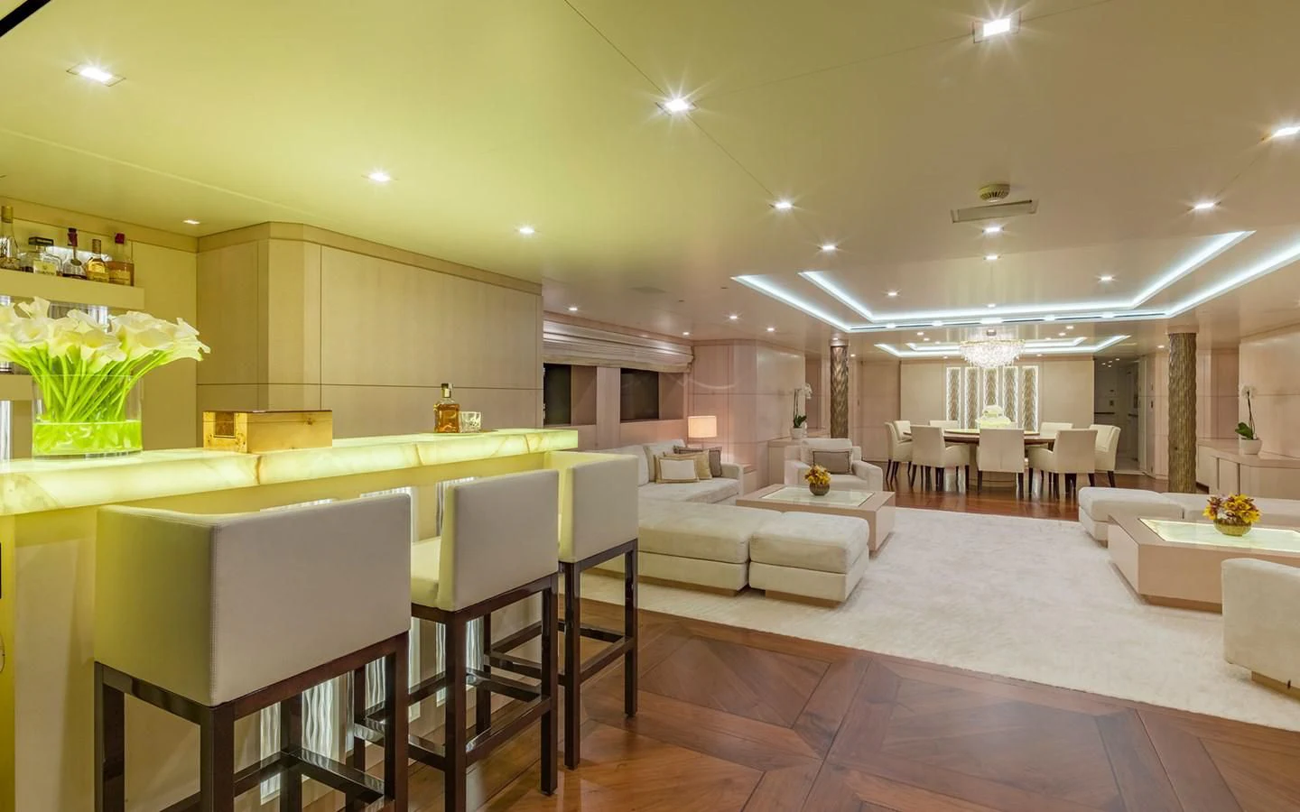 a large room with a table and chairs aboard ROMA Yacht for Sale