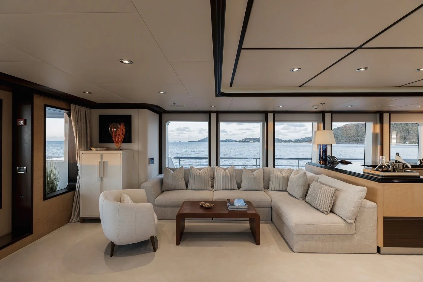 a living room with a large window aboard GLADIATOR Yacht for Sale