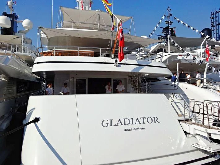 a boat with a group of people on it aboard GLADIATOR Yacht for Sale