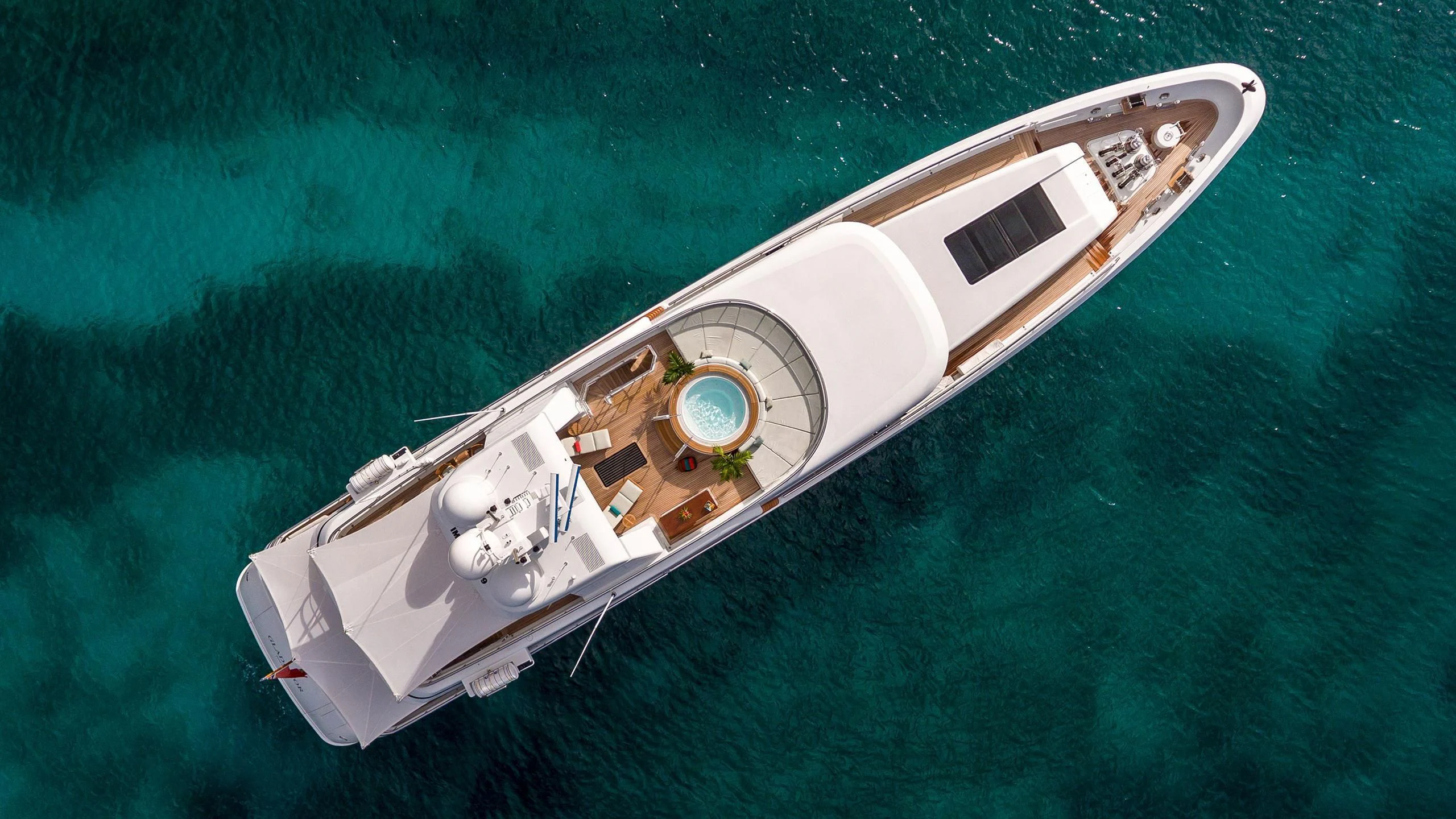 a white boat in the water aboard GLADIATOR Yacht for Sale
