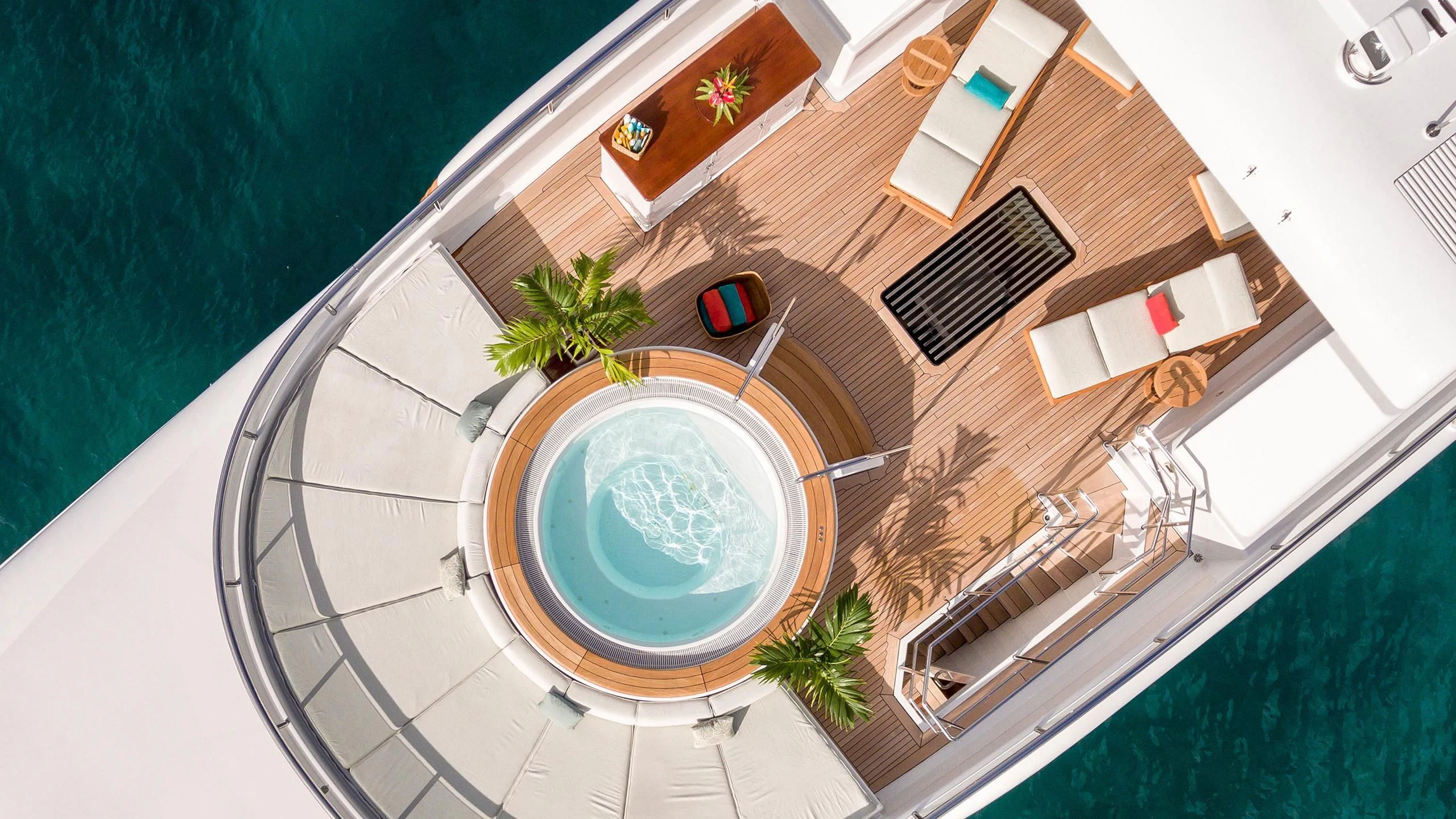 a circular pool with a balcony aboard GLADIATOR Yacht for Sale
