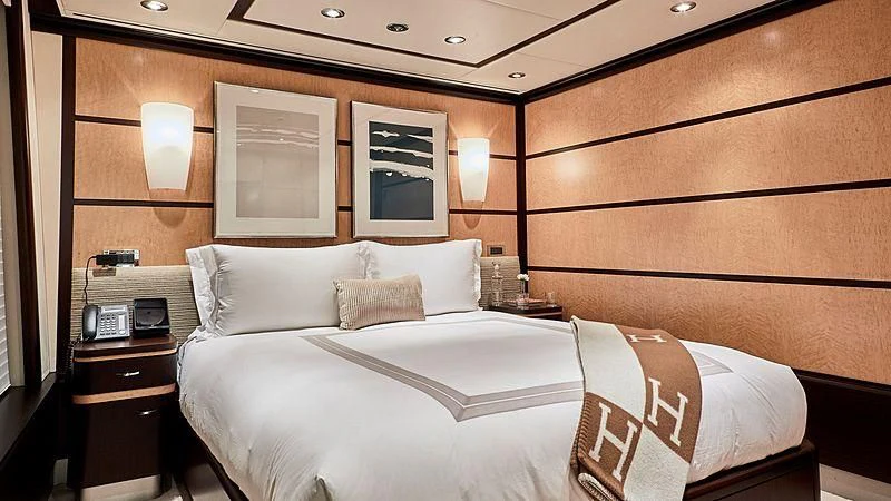 a hotel room with two beds aboard GLADIATOR Yacht for Sale