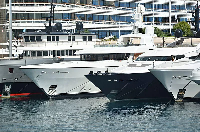 a few white yachts in the water aboard GLADIATOR Yacht for Sale