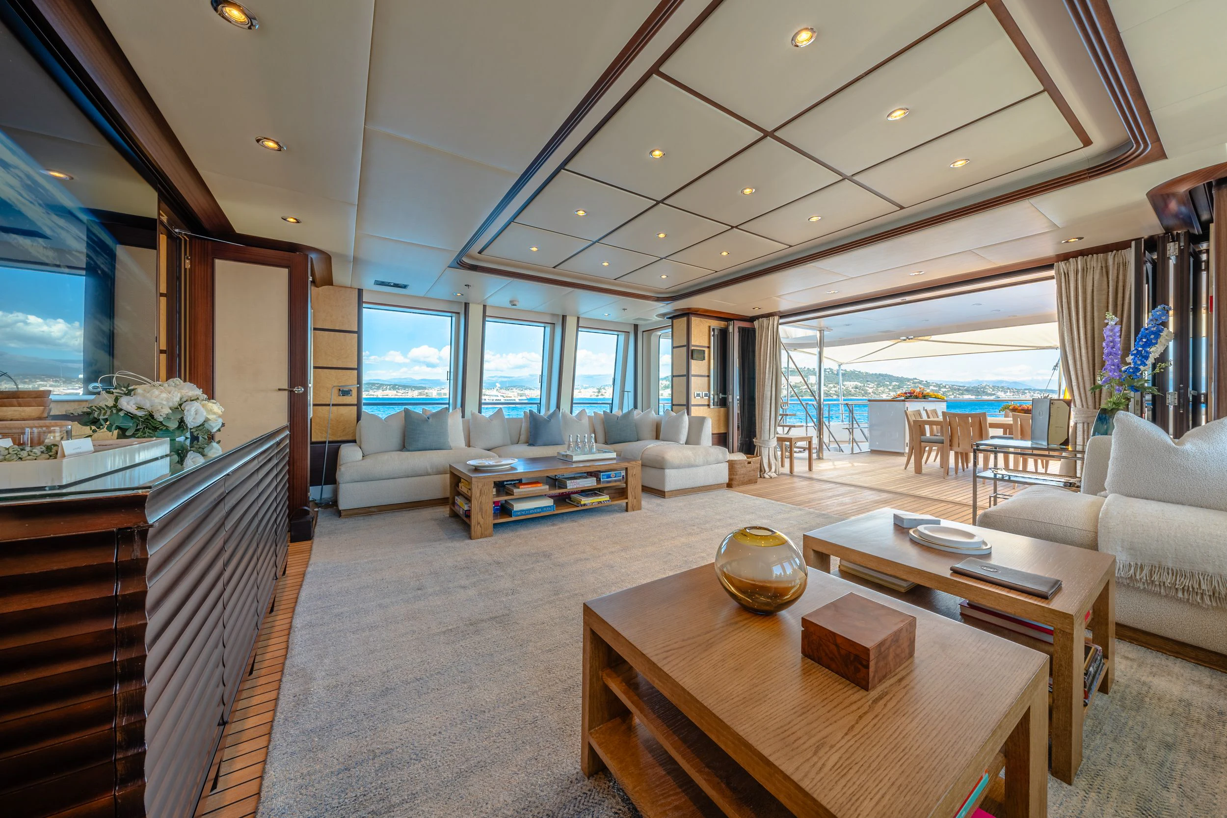 a living room with a large window aboard GLADIATOR Yacht for Sale