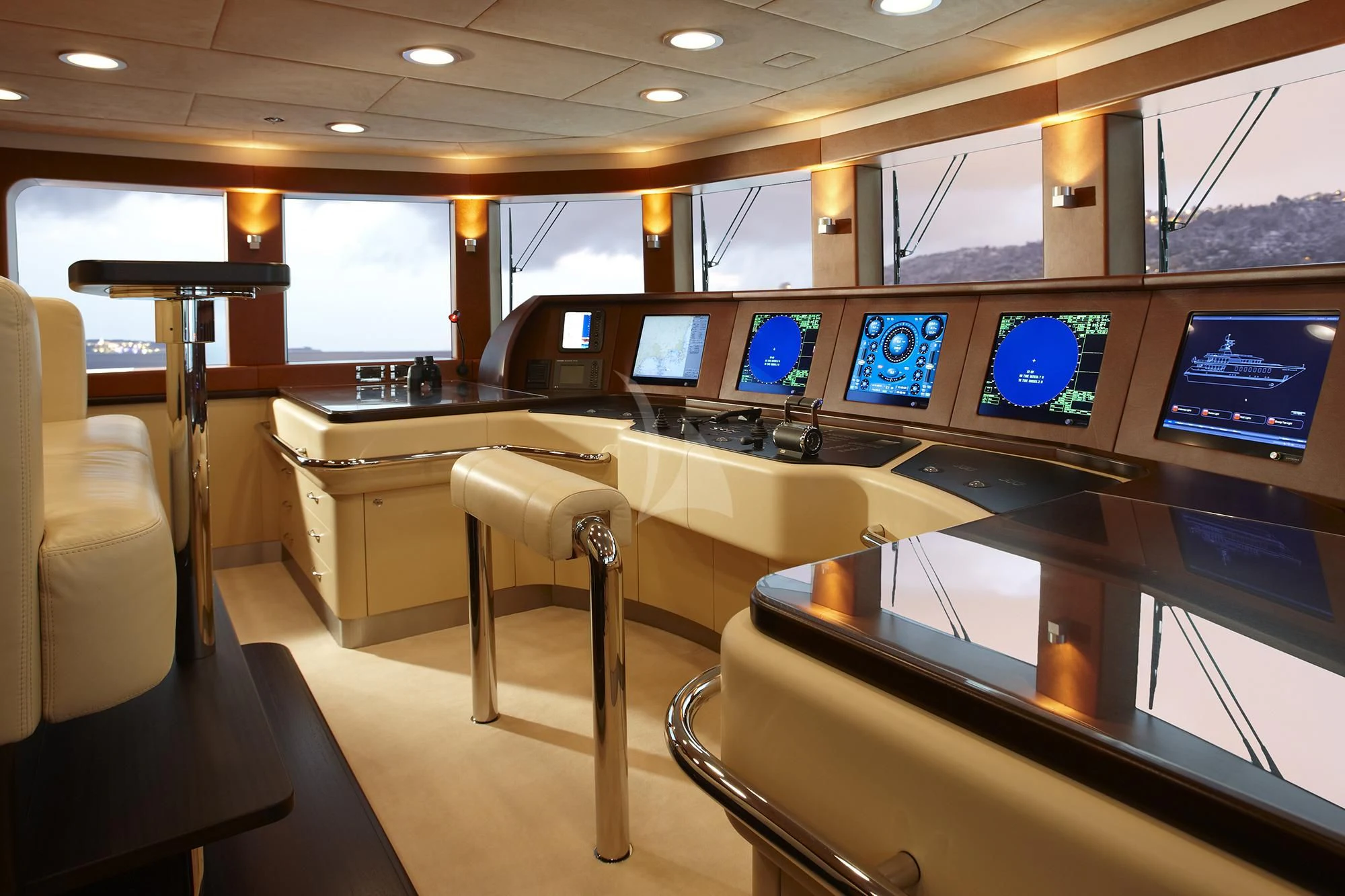 a room with many monitors and chairs aboard GLADIATOR Yacht for Sale
