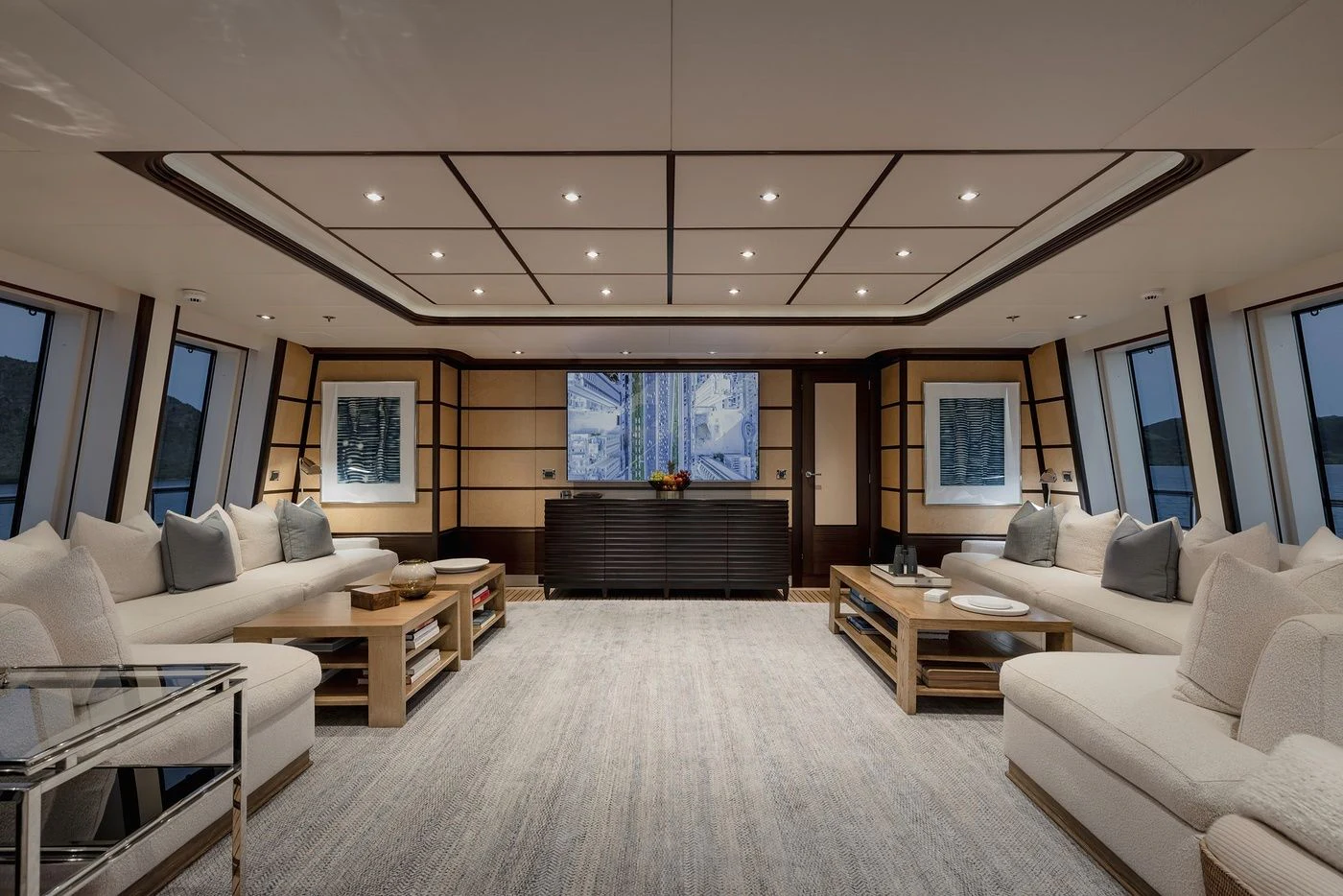 a large living room with a large window aboard GLADIATOR Yacht for Sale