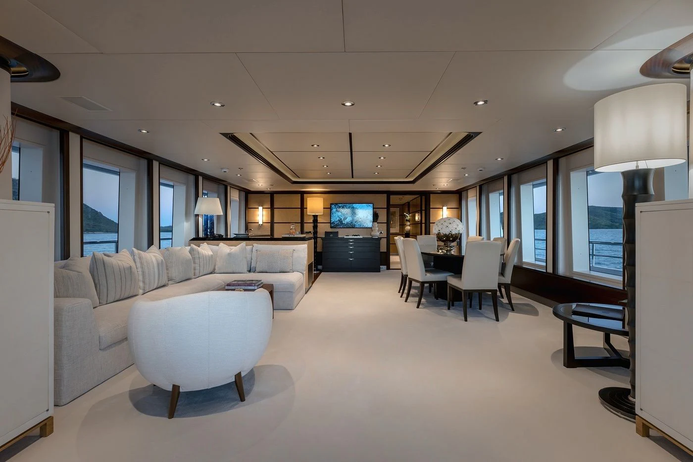 a living room with a large window aboard GLADIATOR Yacht for Sale