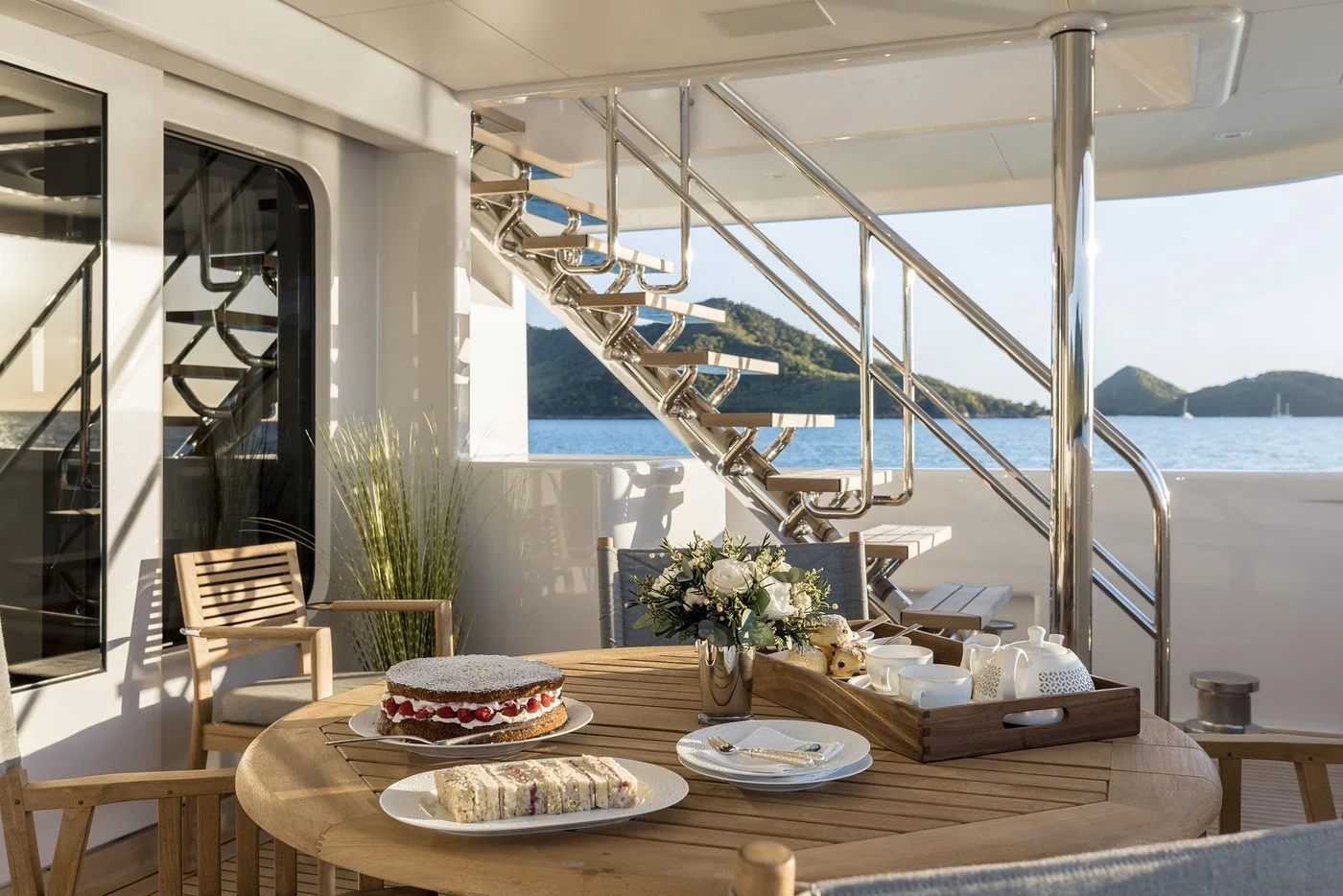 a table with plates and food on it aboard GLADIATOR Yacht for Sale