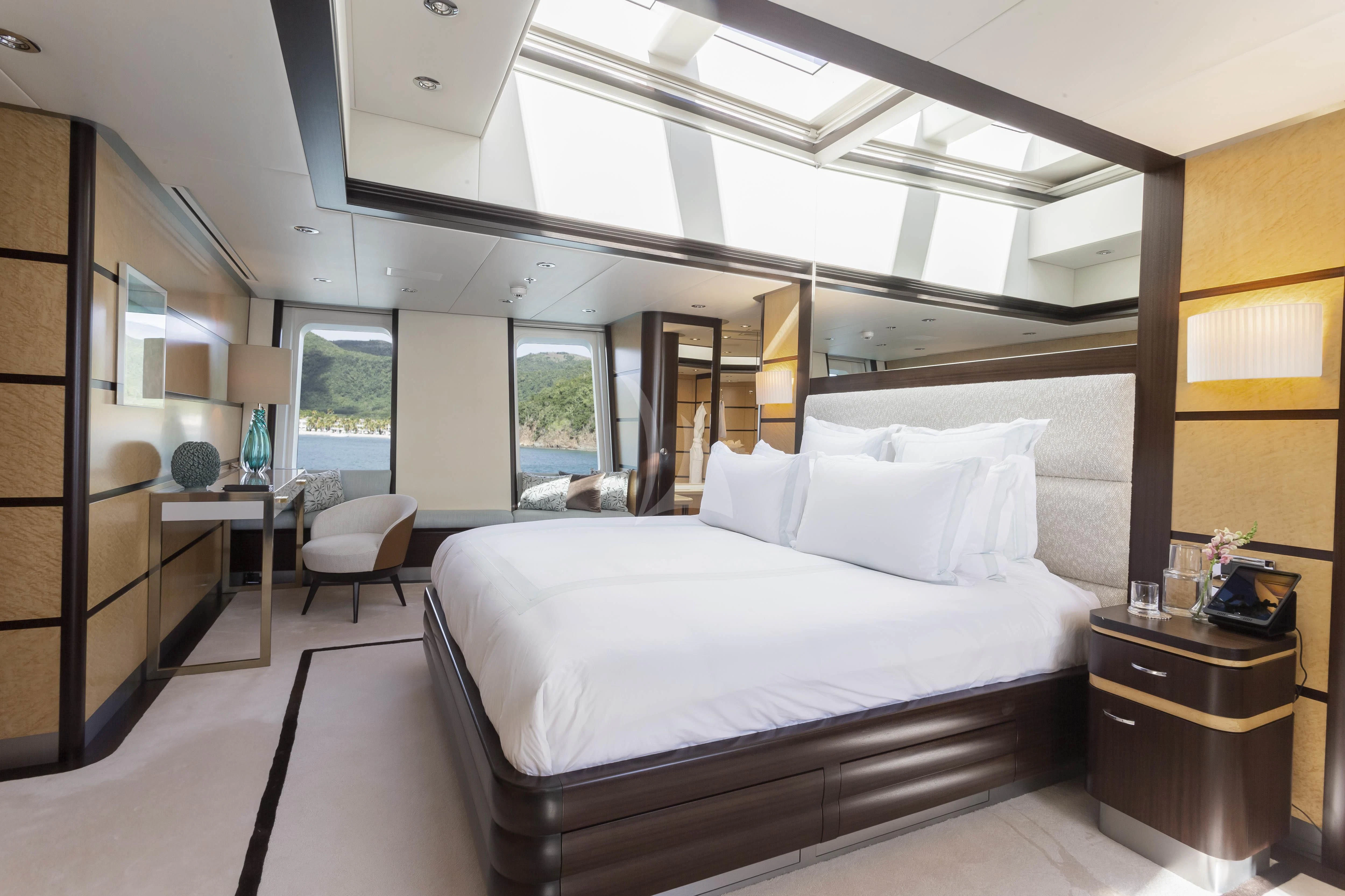 a large bed in a room aboard GLADIATOR Yacht for Sale
