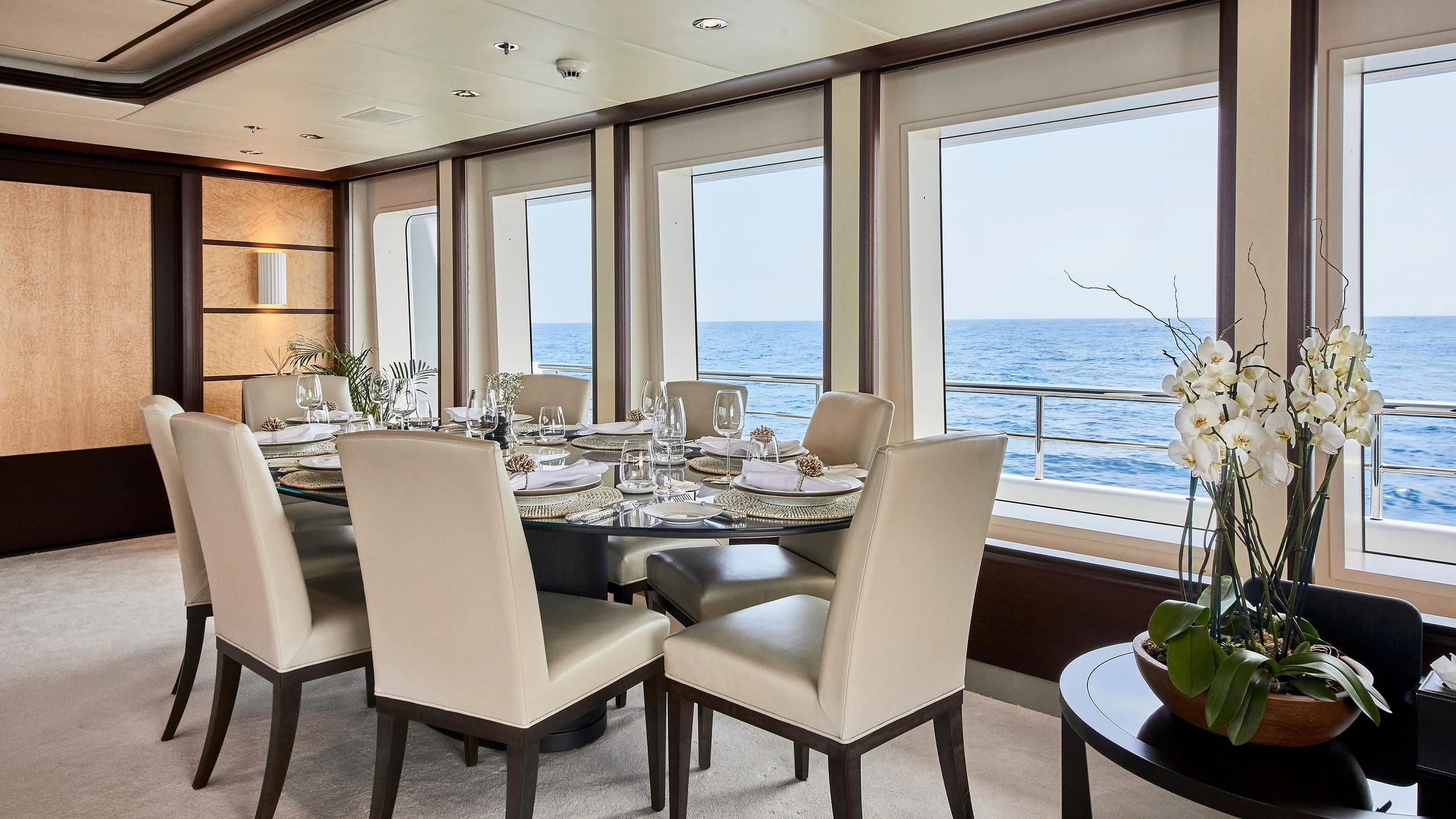 a dining room with a table and chairs aboard GLADIATOR Yacht for Sale