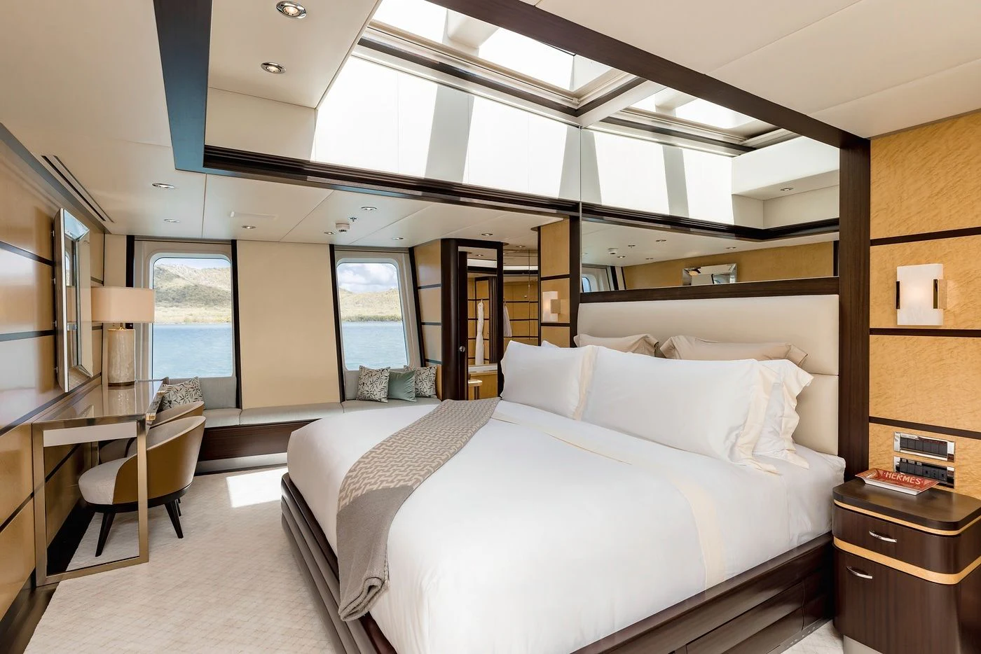 a large bedroom with a large bed aboard GLADIATOR Yacht for Sale