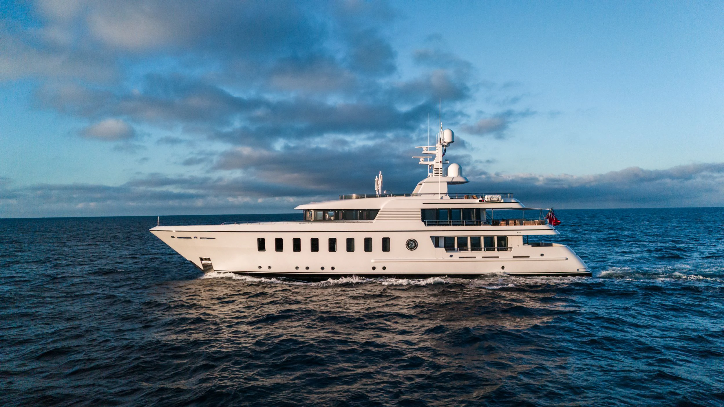a white boat in the water aboard GLADIATOR Yacht for Sale