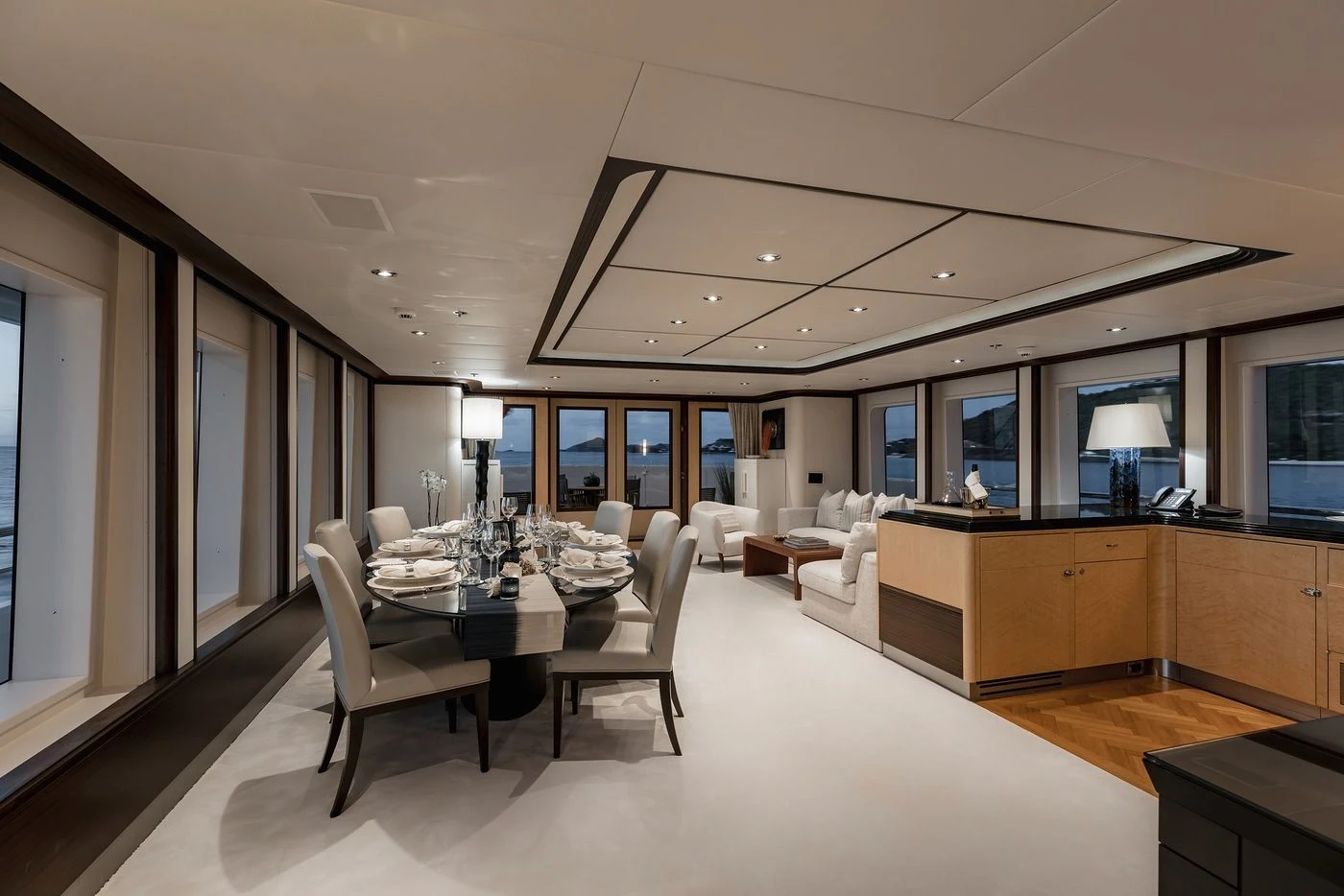 a room with a table chairs and a large window aboard GLADIATOR Yacht for Sale