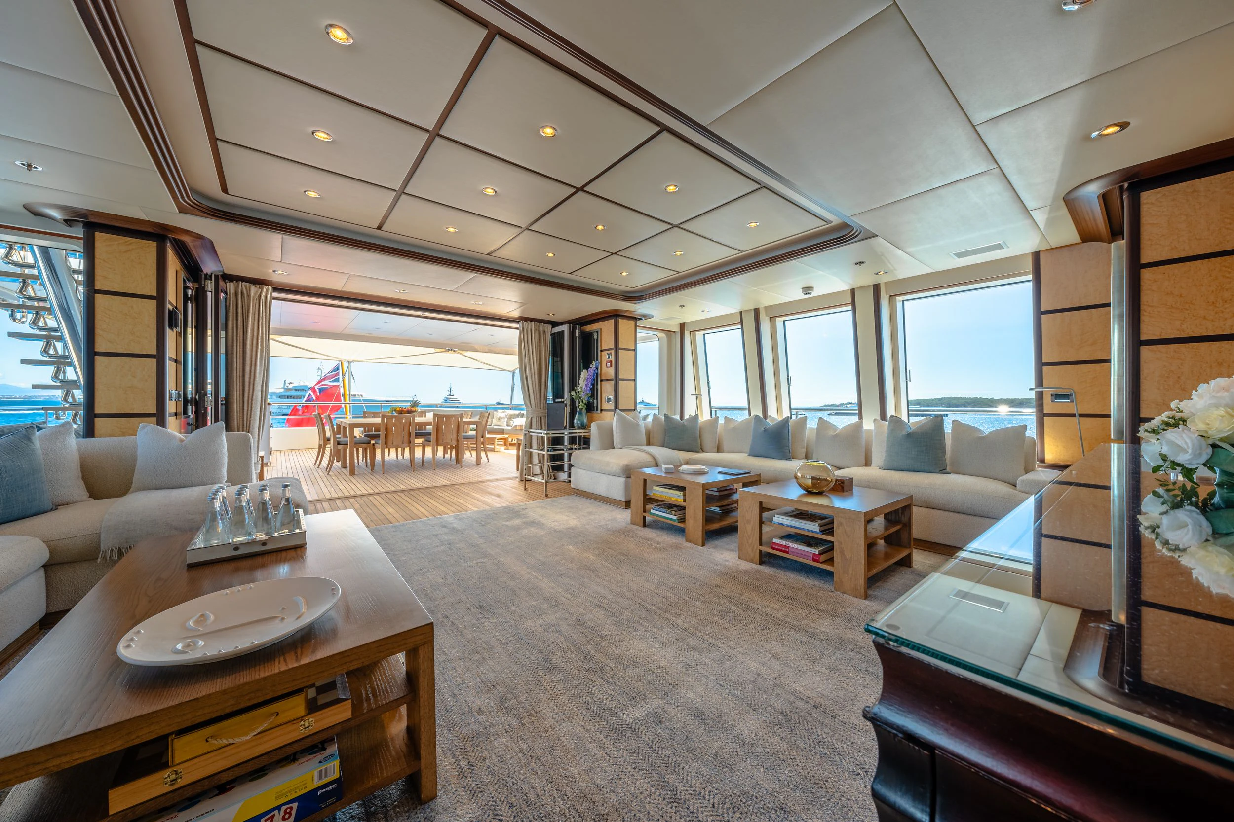 a living room with a large window aboard GLADIATOR Yacht for Sale