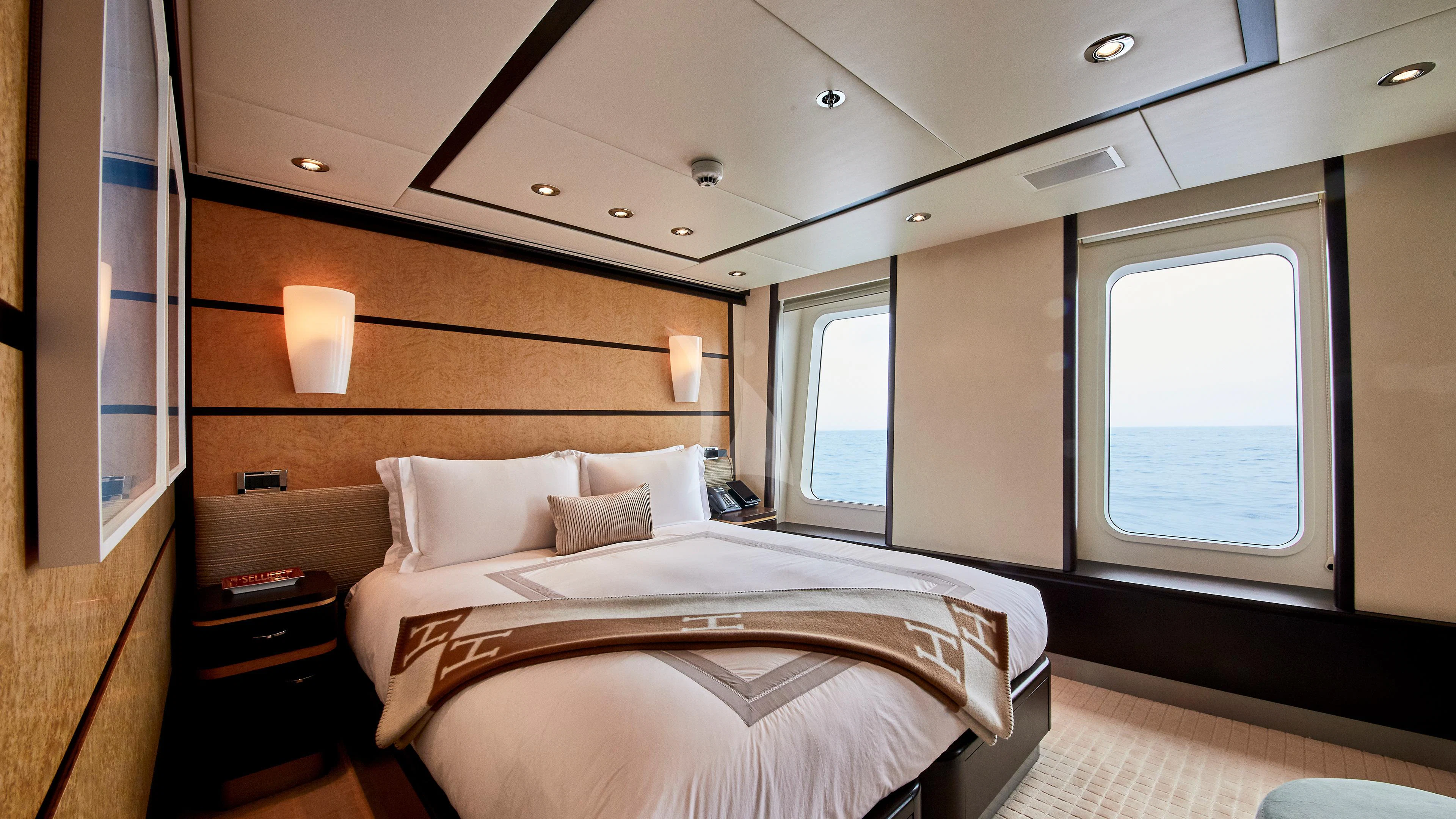a room with two beds aboard GLADIATOR Yacht for Sale