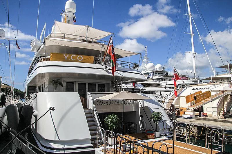 a boat docked at a pier aboard GLADIATOR Yacht for Sale