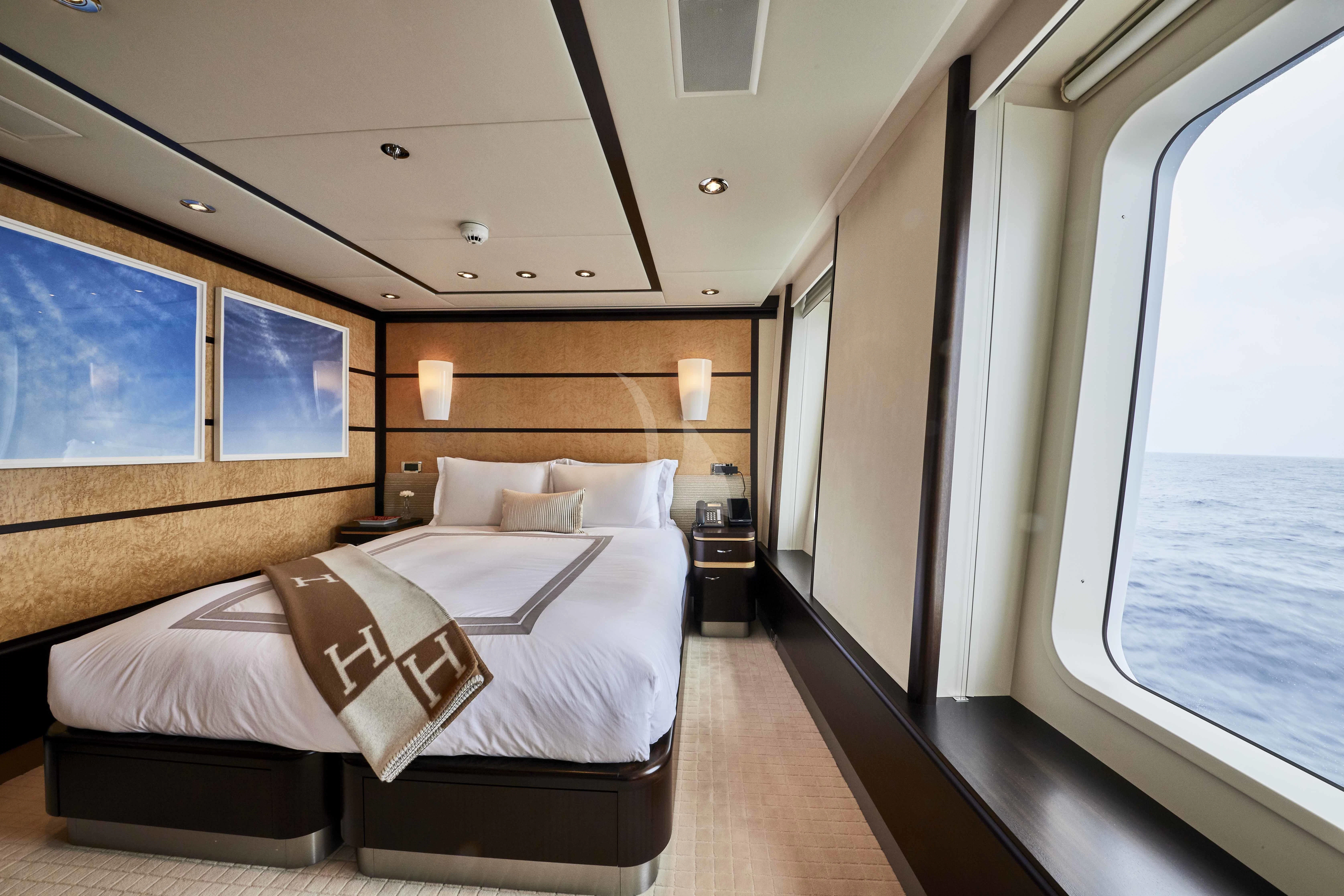 a bedroom with a large bed aboard GLADIATOR Yacht for Sale