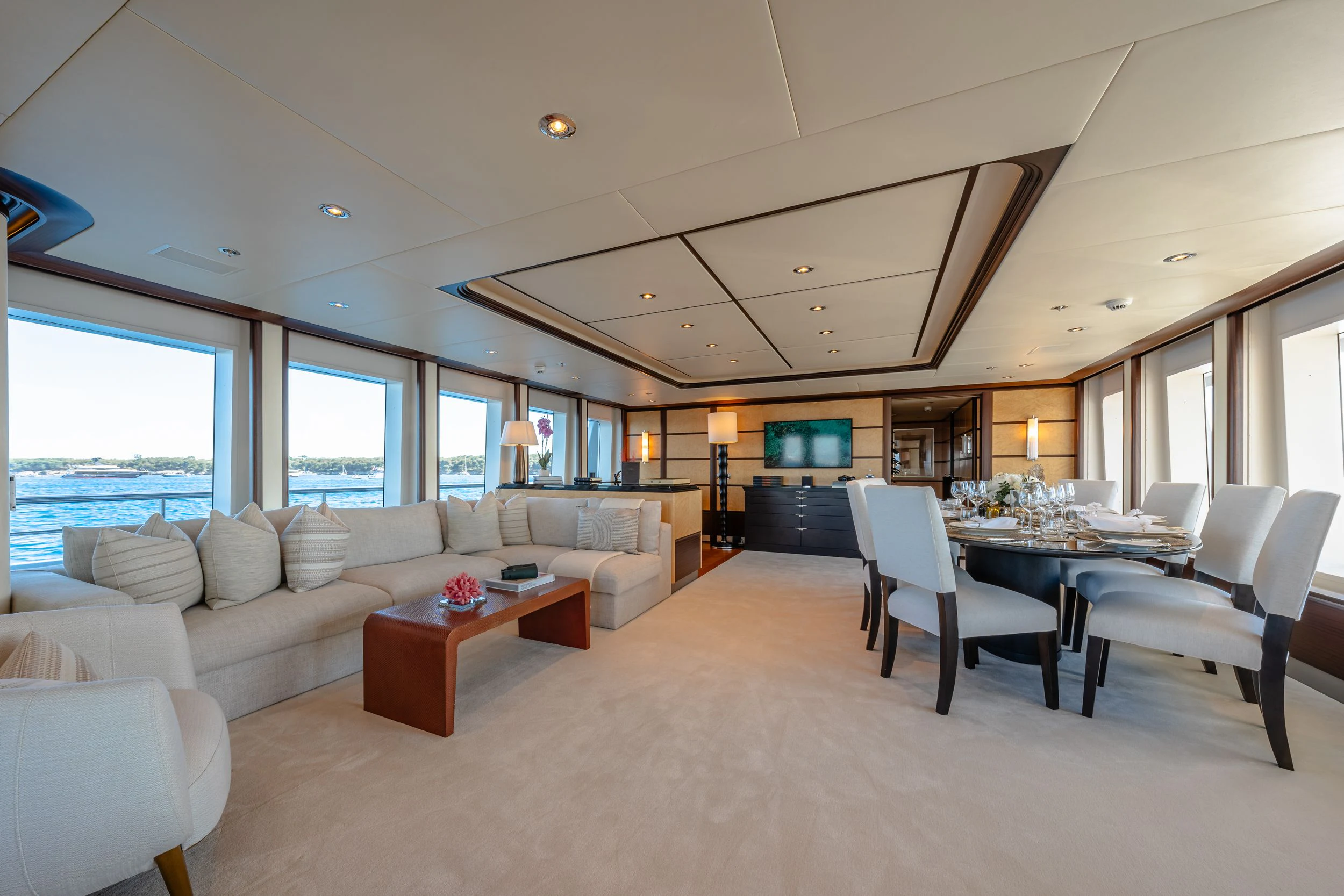 a living room with a couch and a table aboard GLADIATOR Yacht for Sale