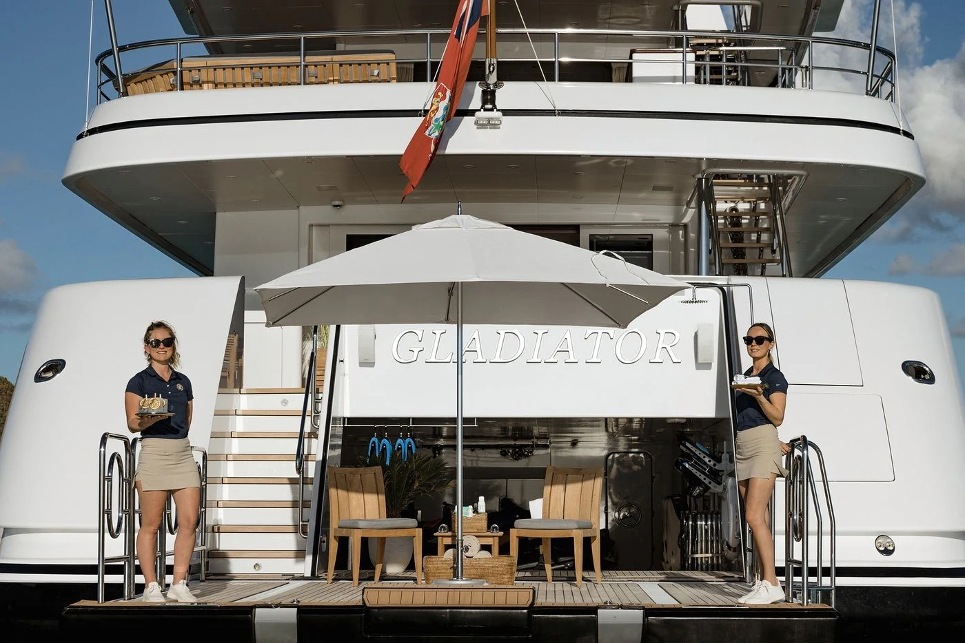 a person standing on a staircase aboard GLADIATOR Yacht for Sale