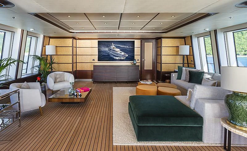 a living room with a large screen aboard GLADIATOR Yacht for Sale