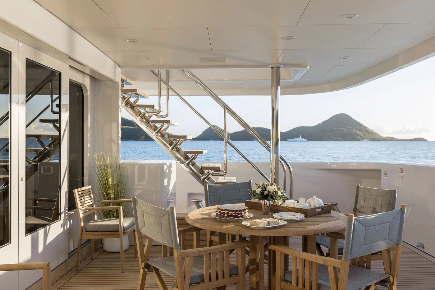 a table on a deck aboard GLADIATOR Yacht for Sale