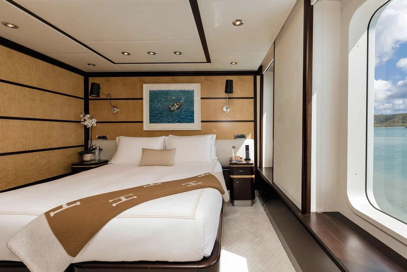 a room with a bed and a window aboard GLADIATOR Yacht for Sale